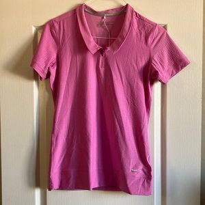 Nike Golf Tour Performance Dri Fit hot pink short sleeved zipper top.